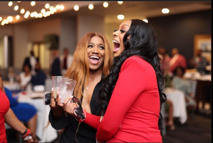 Guests laughing together at Spring Kreme